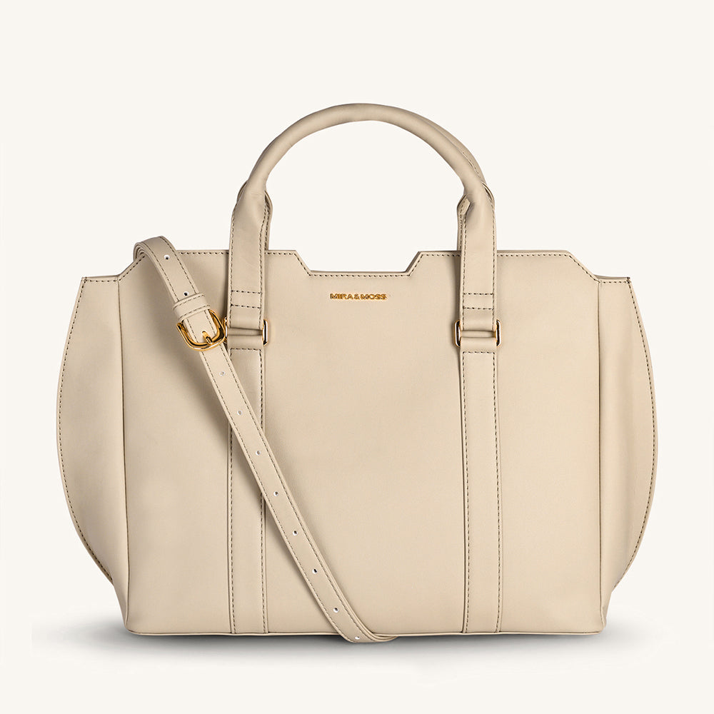 Light taupe structured crossbody bag with top handles and adjustable shoulder strap
