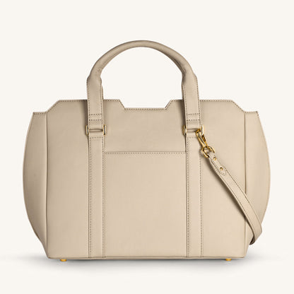 Light taupe crossbody bag with front zip pocket, top handles, and gold hardware