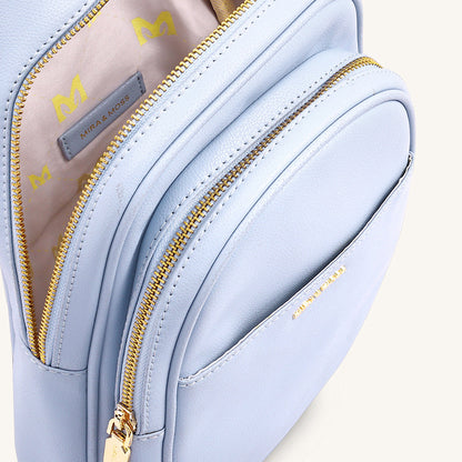 Ice blue fanny bag interior and side panel with gold zippers