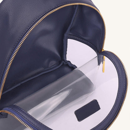 Navy clear backpack interior pocket with gold zipper trim and small label