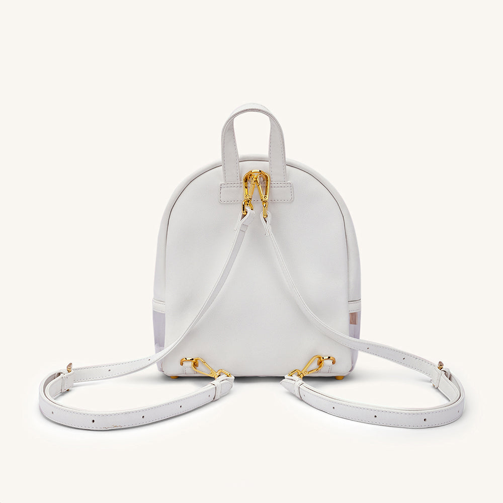 Ivory mini backpack with dual top handles, gold hardware, and two adjustable straps