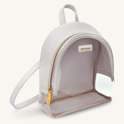 Ivory clear-front mini backpack with gold zipper and curved front pocket