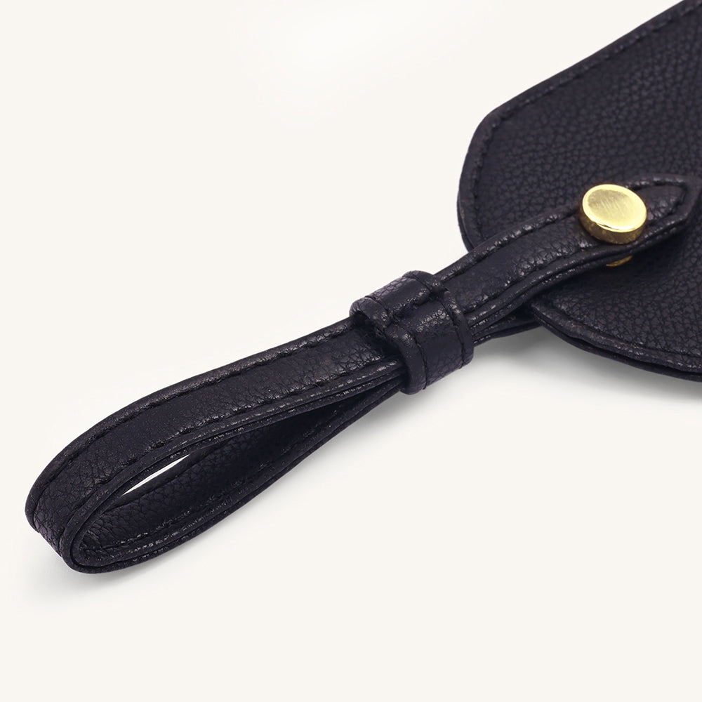 Black leather travel tag with stitched strap and round gold snap button