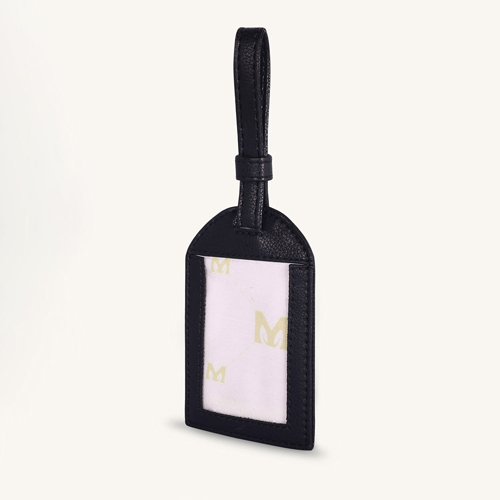 Black leather travel tag with clear label window and gold M icon