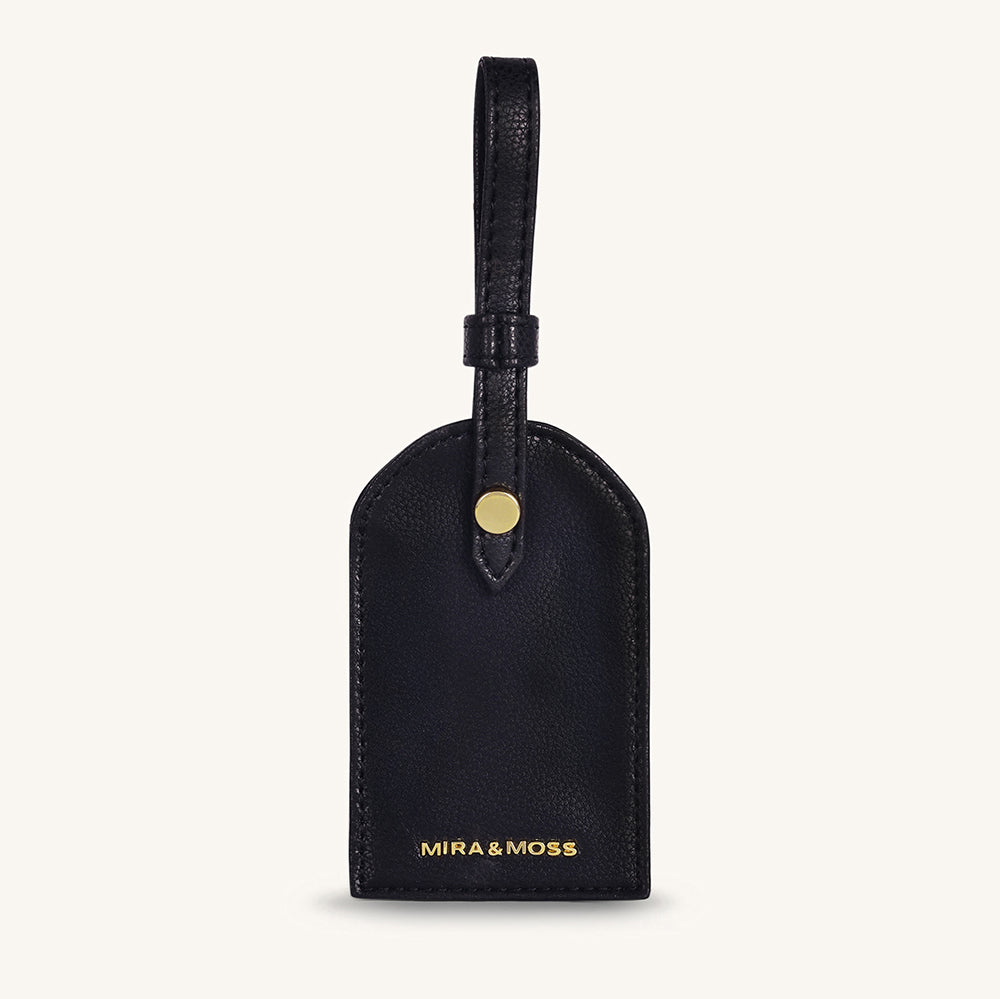 Black leather travel tag with top loop and gold MIRA&MOSS logo