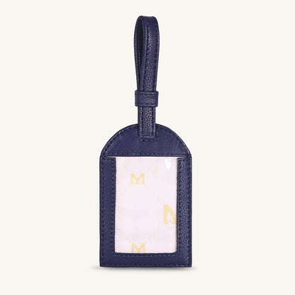 Alexis travel tag with dark blue leather and clear ID window, gold accents