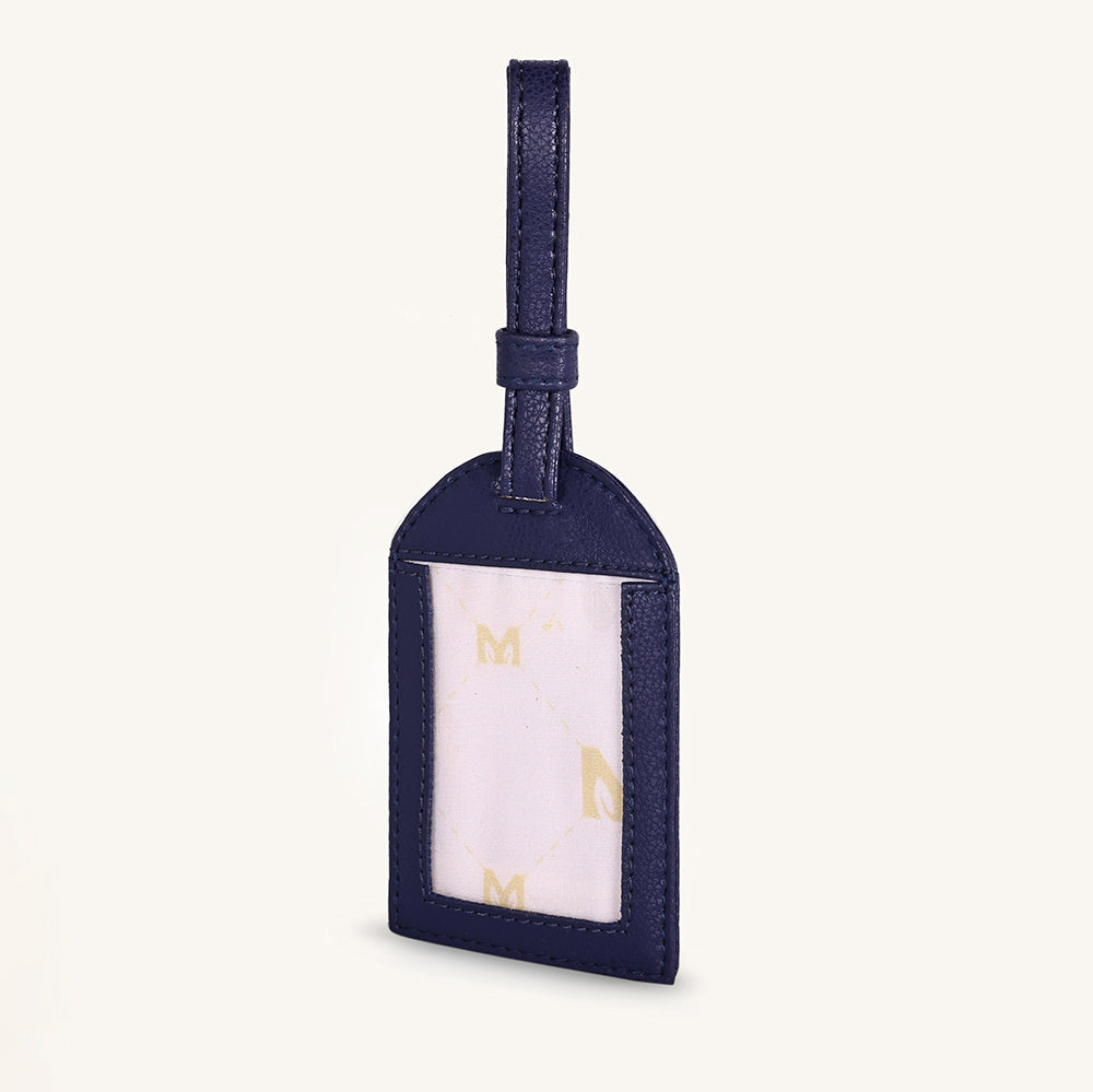 Alexis travel tag with clear ID window and dark blue leather, hanging loop
