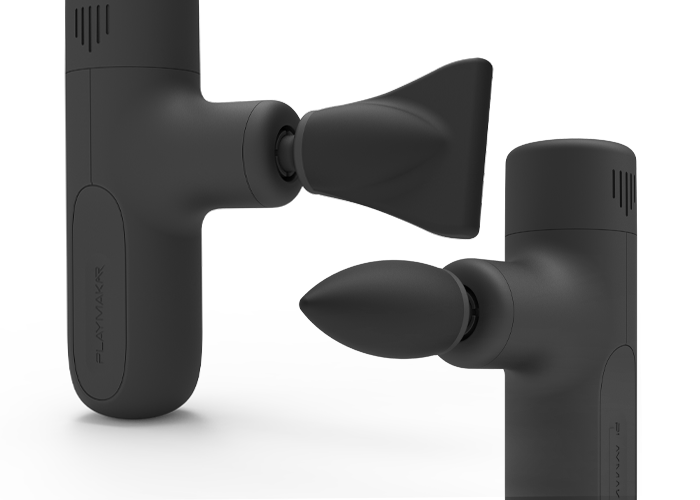 Black massage gun with edge and bullet head attachments, side view