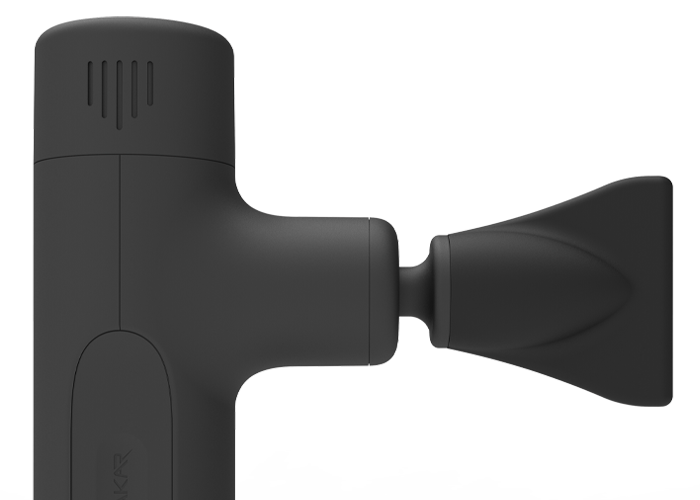 Black massage gun with wide edge head attachment, close side view