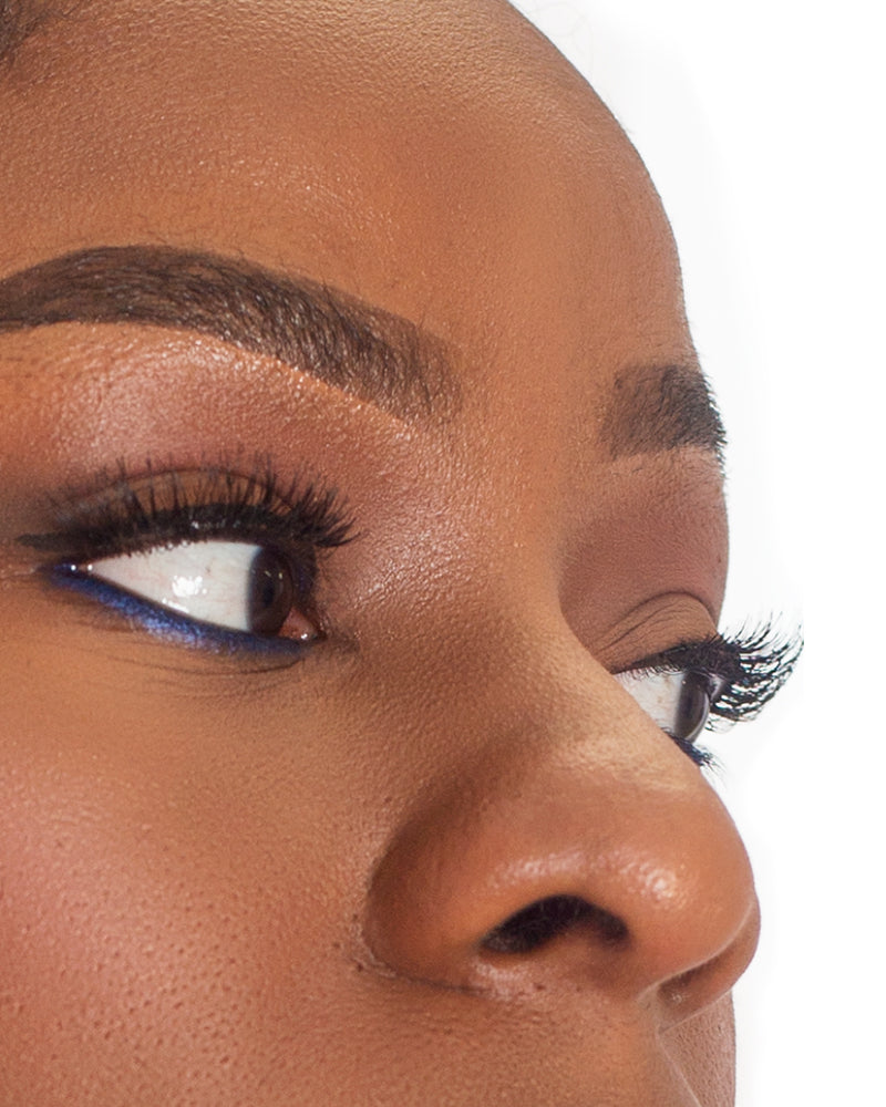 Black mascara on lashes, eye close-up with thickened curl