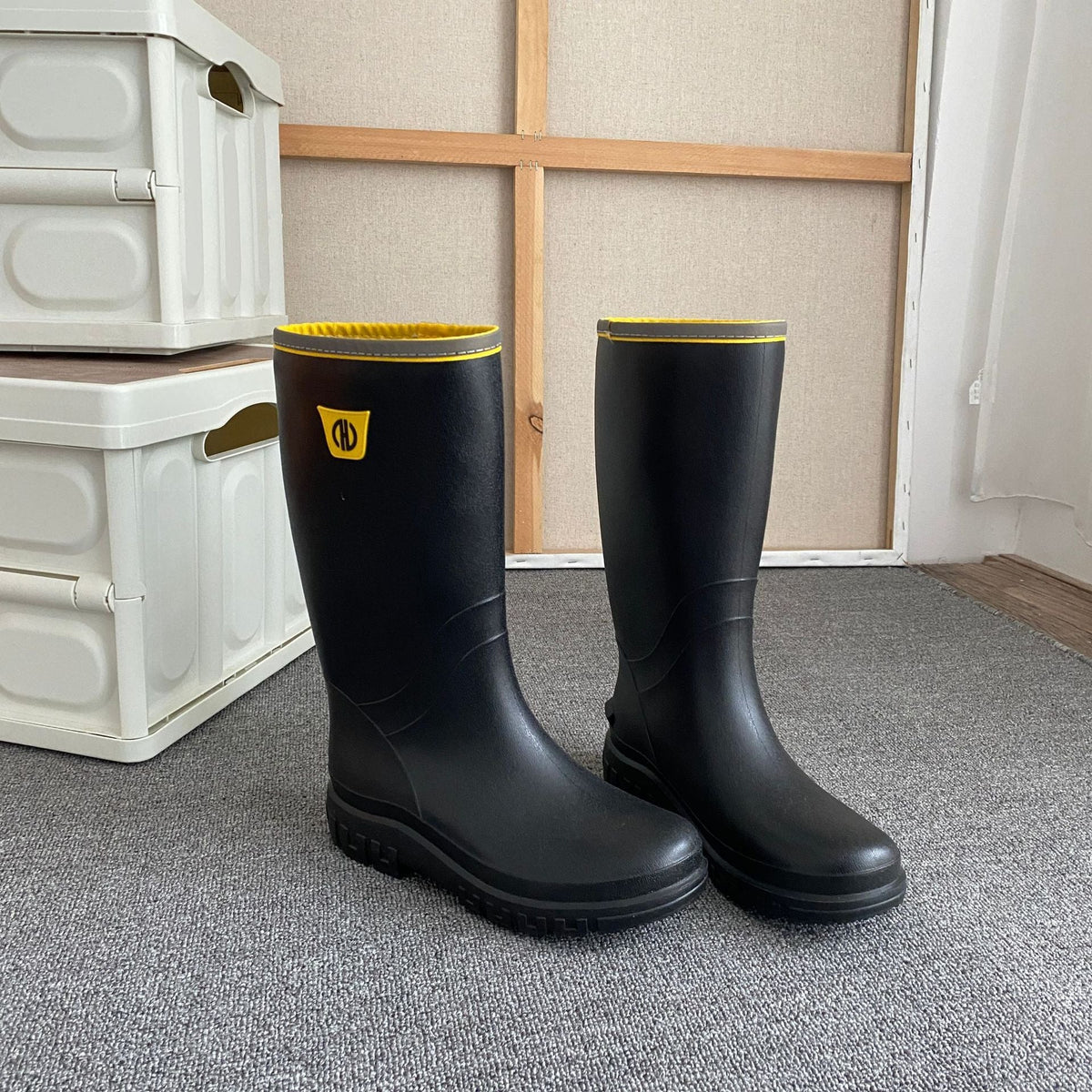 Men's knee-high rain boots, black with yellow top trim and accents