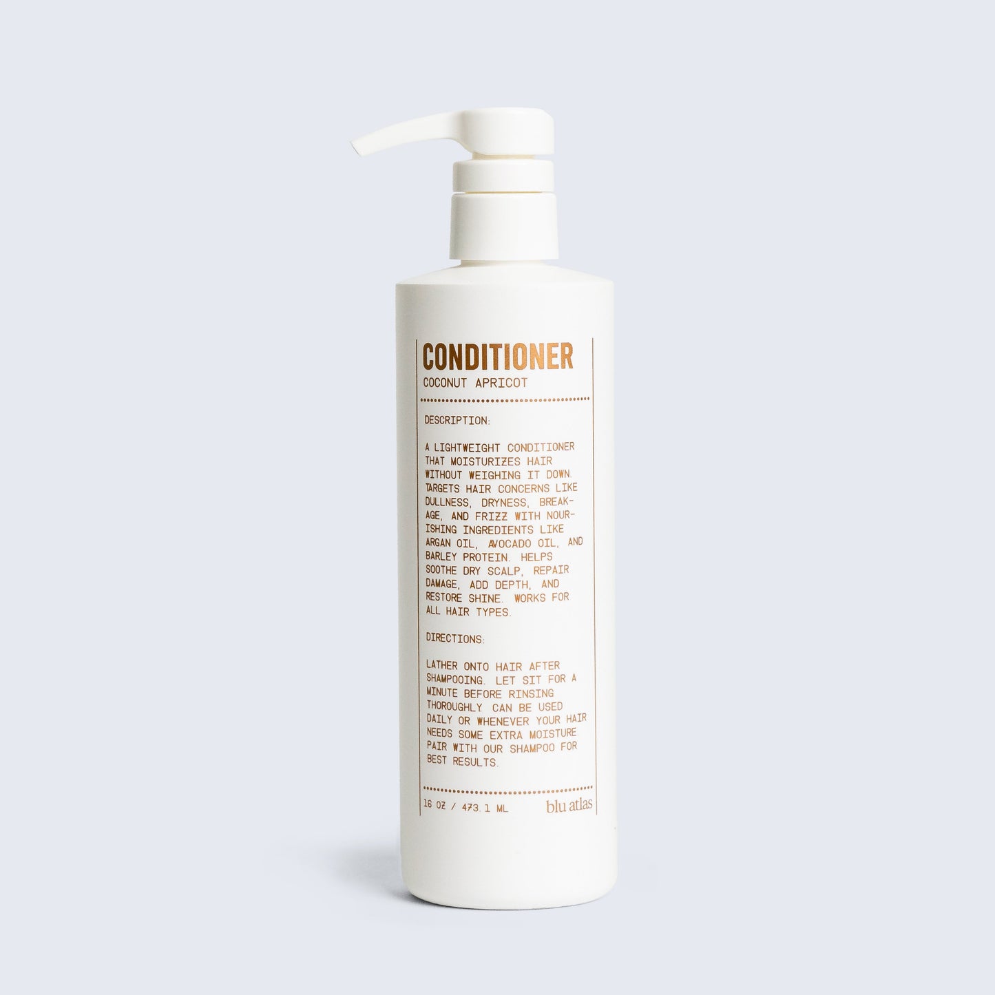 Conditioner bottle with pump, coconut apricot scent label visible