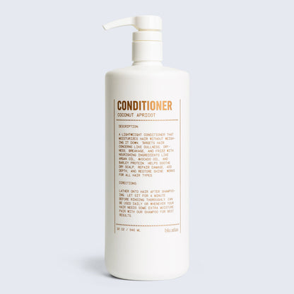 Conditioner bottle with pump, coconut apricot scent label on back