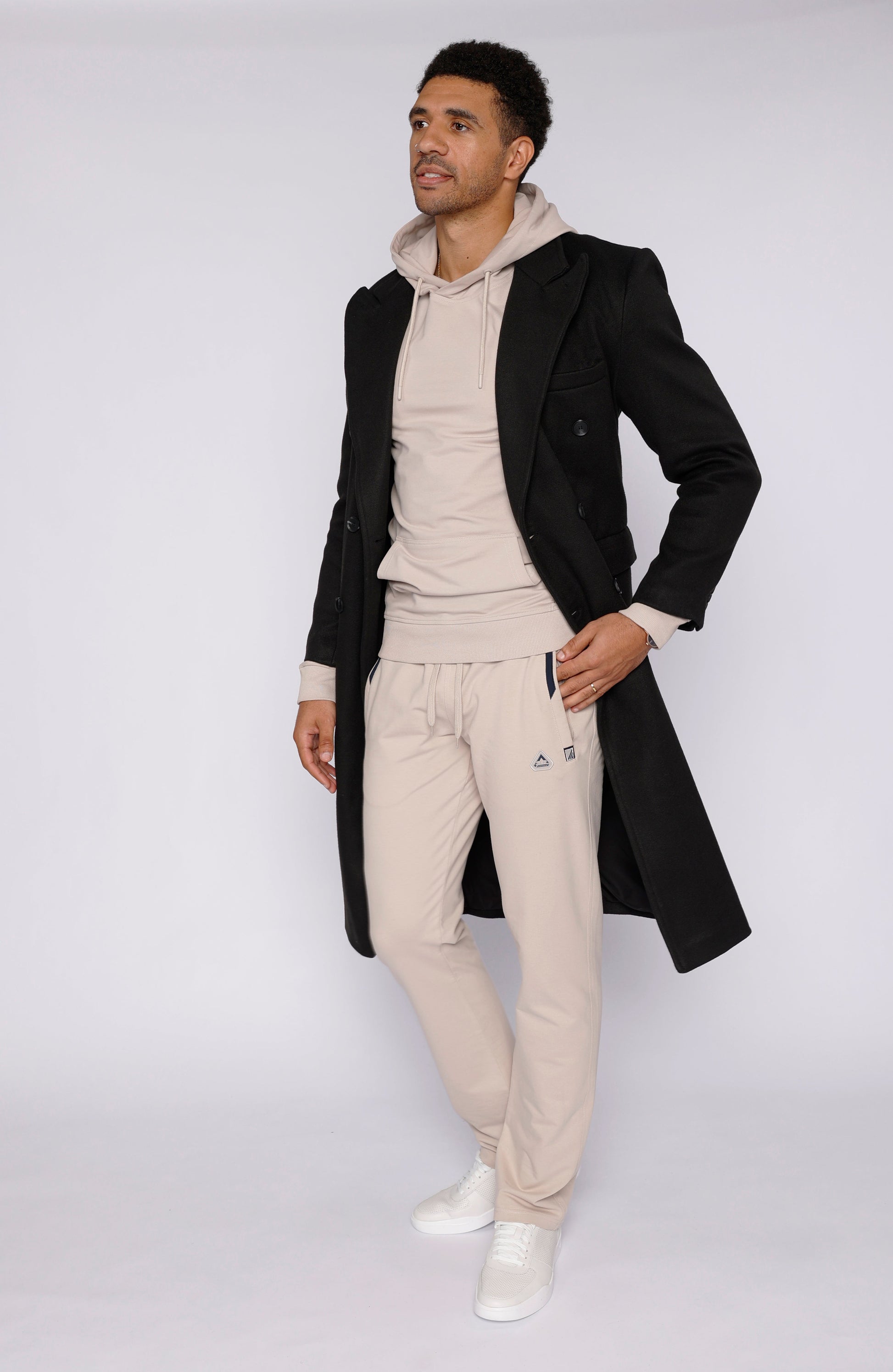 Men’s athletic straight sweatpants in light beige with elastic waistband and side pockets
