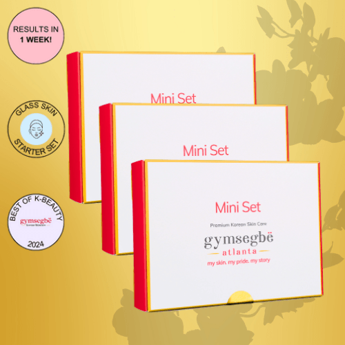 Stack of three skincare mini set boxes with red borders and gold accents