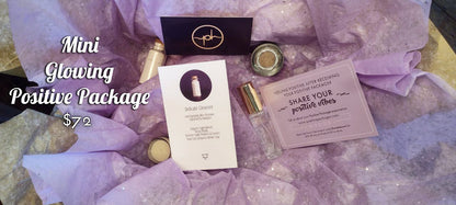 Skincare gift set laid out with jars, tubes, and two greeting-style cards