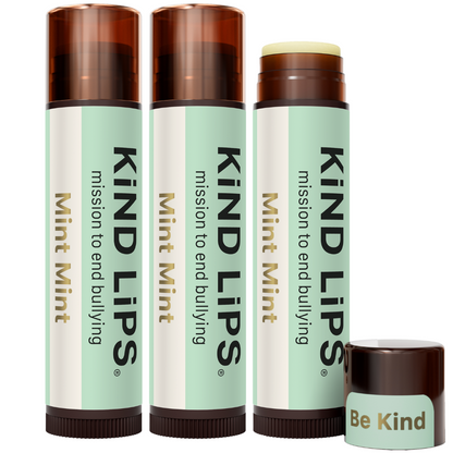 Mint Mint lip balm set of three tubes with brown caps and a Be Kind mini