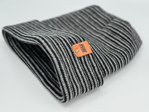 Folded striped knit beanie in gray and black with orange brand tag