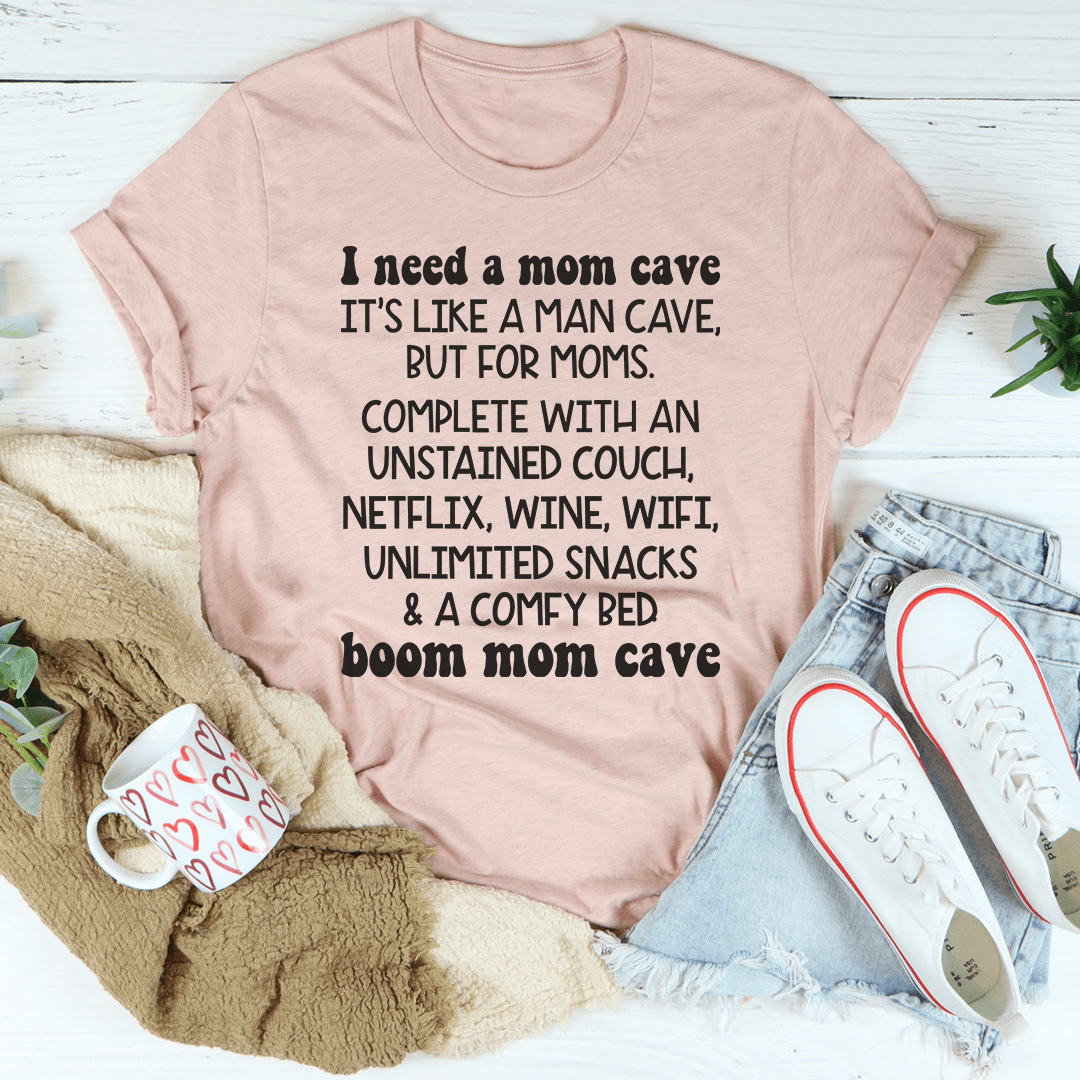 Mauve crew-neck T-shirt with short sleeves and centered mom cave slogan graphic.