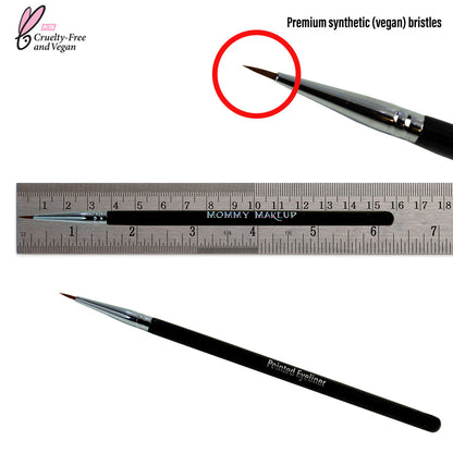 Pointed eyeliner brush with tapered tip beside measuring ruler