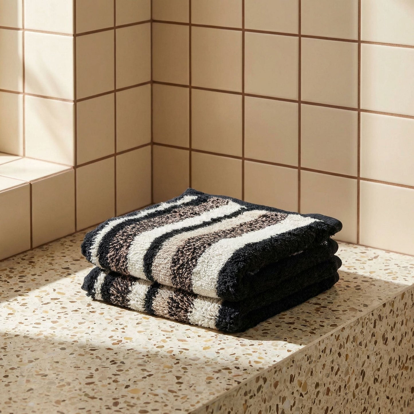 Striped cotton bath towel, black and white horizontal stripes, folded