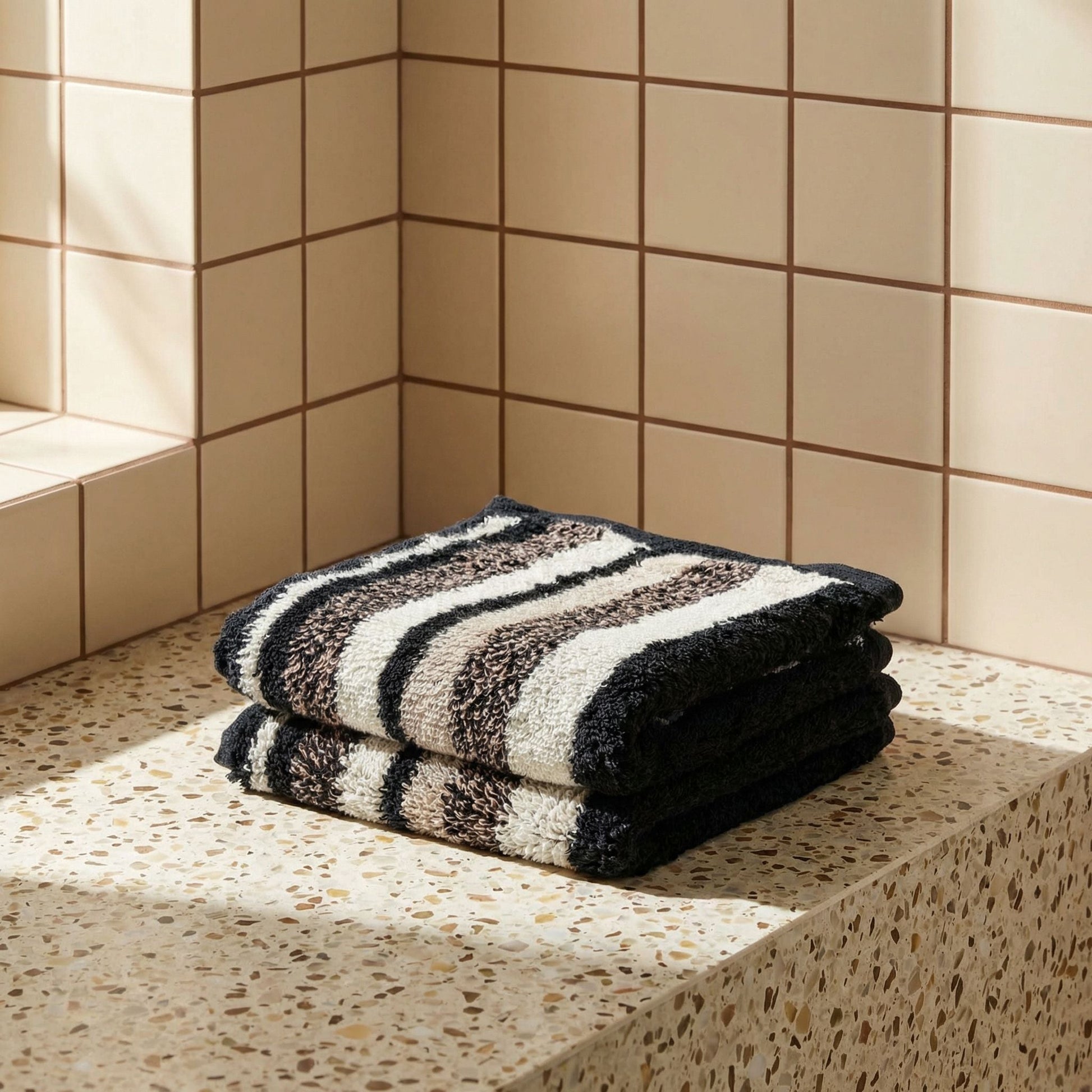 Striped cotton bath towel, black and white horizontal stripes, folded