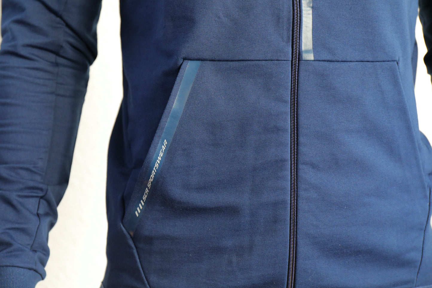 Navy zip-up hooded slim-fit sweatshirt with front pockets and zipper seam detail