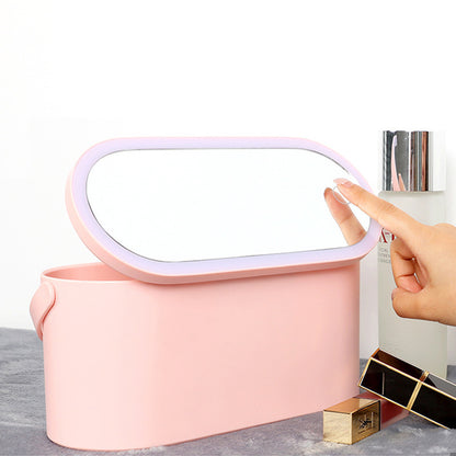 Pink makeup organizer box with hinged lid handle and open top for storing cosmetics