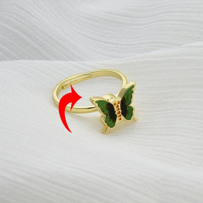 Butterfly rotatable ring with gold band and blue butterfly enamel, spinning arrow