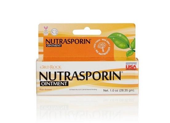 Nutrasporin ointment carton, orange-and-beige front with leaf graphic