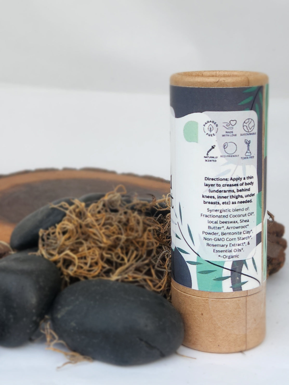 Natural deodorant stick in cardboard tube, back panel with directions and icons.