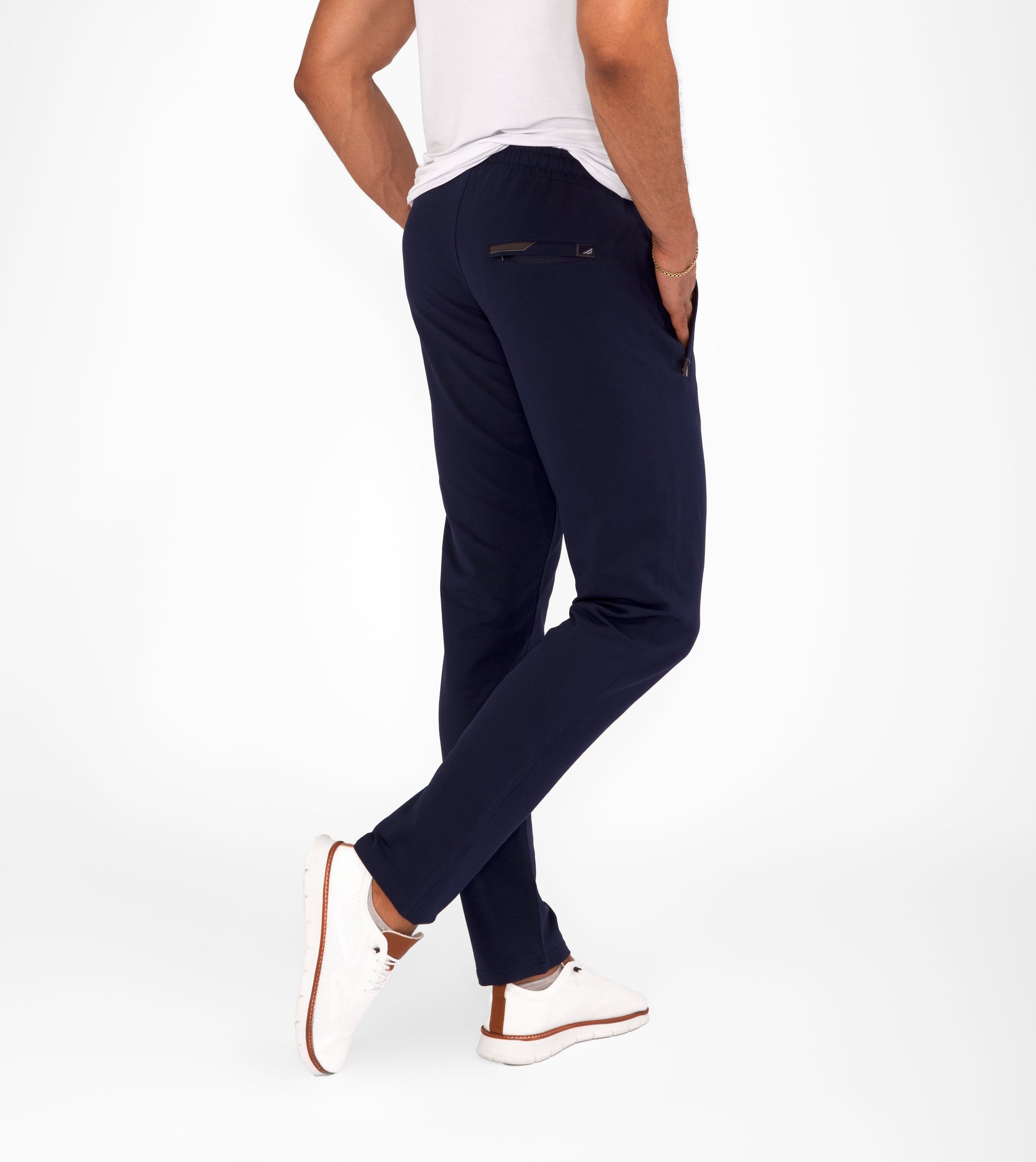 Navy tapered athletic sweatpants with drawstring waist and zippered side pockets