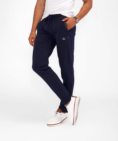 Navy tapered athletic sweatpants with zippered side pockets and elastic waistband