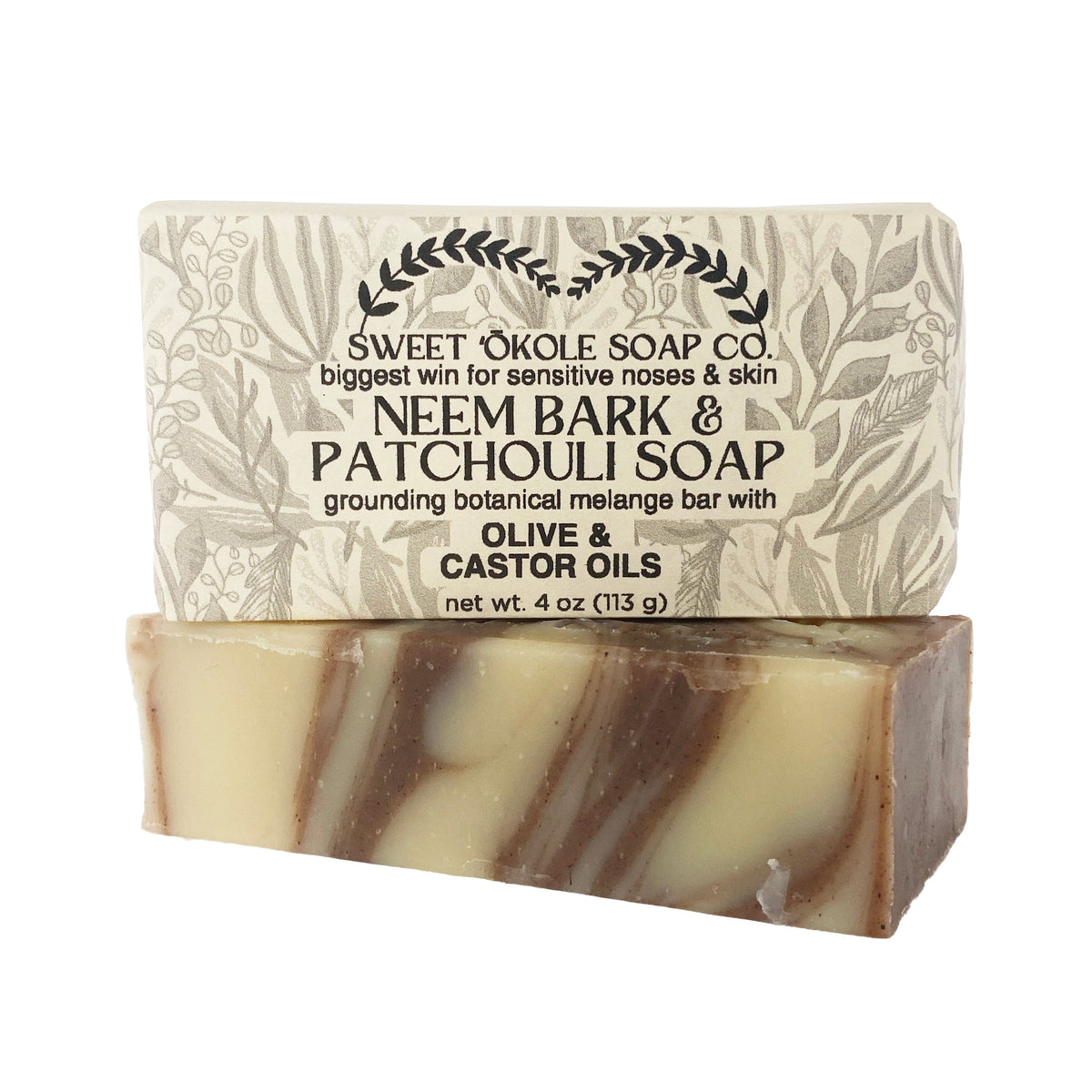 Neem Bark & Patchouli Soap bar, light beige with dark swirls and stamped leaf pattern