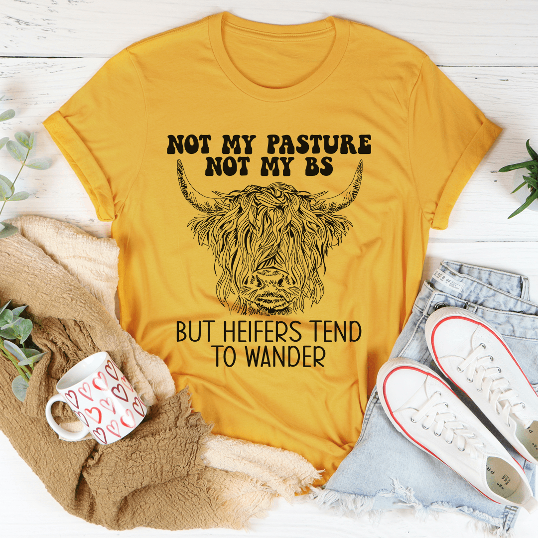 Mustard T-shirt with cow head graphic and 'But heifers tend to wander' quote
