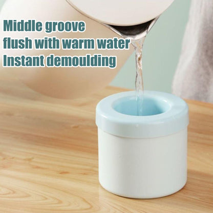 Light blue silicone ice maker bucket receiving water into the center opening