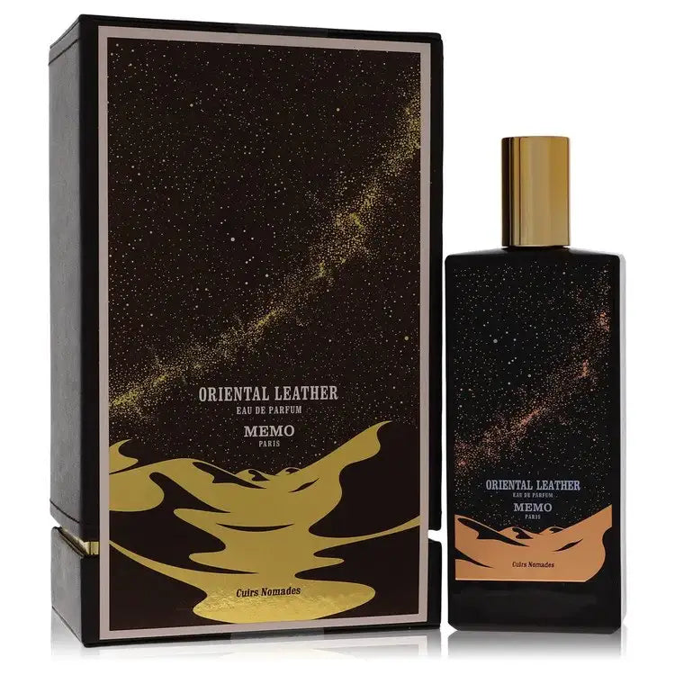 Unisex eau de parfum bottle with gold cap beside matching black gift box and label