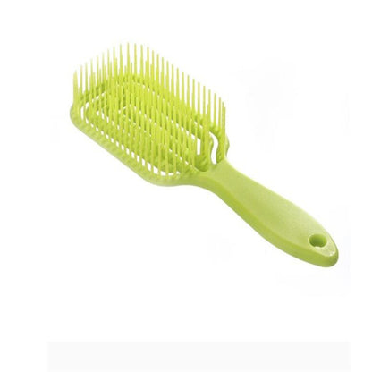 Vented hair comb with lime-green handle and light yellow teeth
