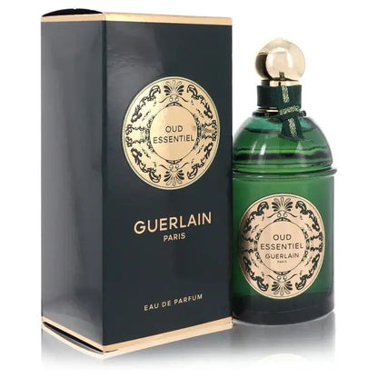 Green perfume bottle and dark Guerlain eau de parfum box with gold ornamental logo