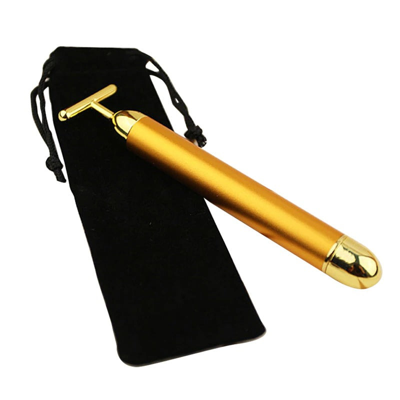 Gold T-shaped facial roller massager with black drawstring pouch