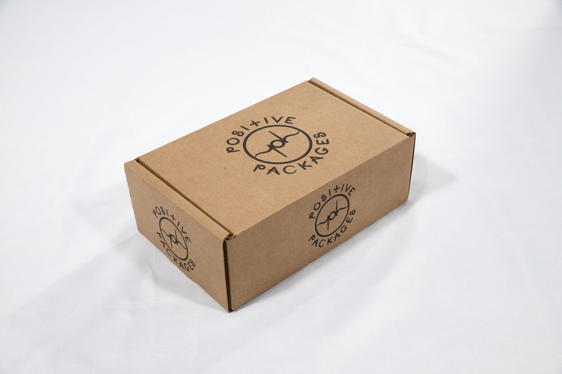 Kraft cardboard package box with printed logo and branding on top