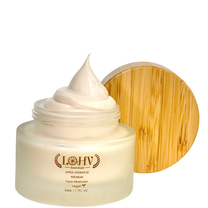 Face moisturizer open jar with pale cream dollop and gold round lid