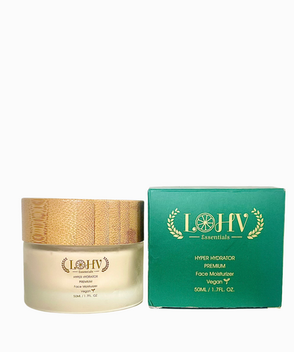 Face moisturizer jar with gold lid next to teal rectangular box
