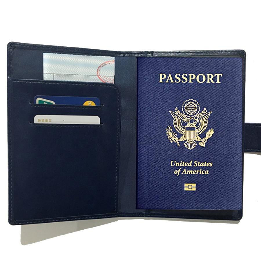Black passport wallet open, card slots and U.S. passport cover visible