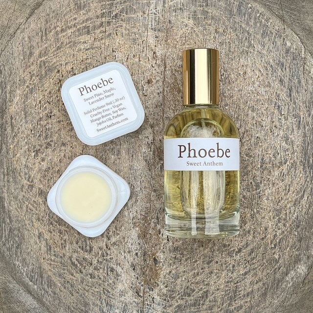 Phoebe Sweet Anthem perfume bottle with balm jar, white lid, and label card