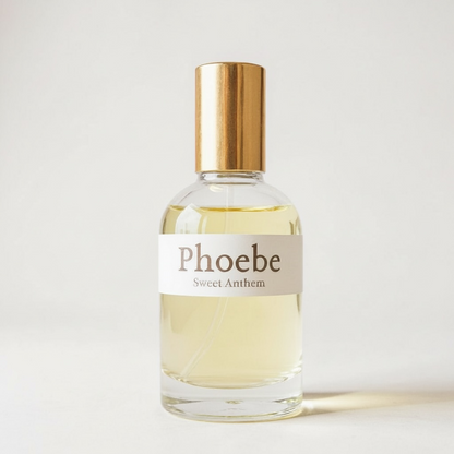 Phoebe Sweet Anthem perfume bottle with gold cap, pale yellow liquid