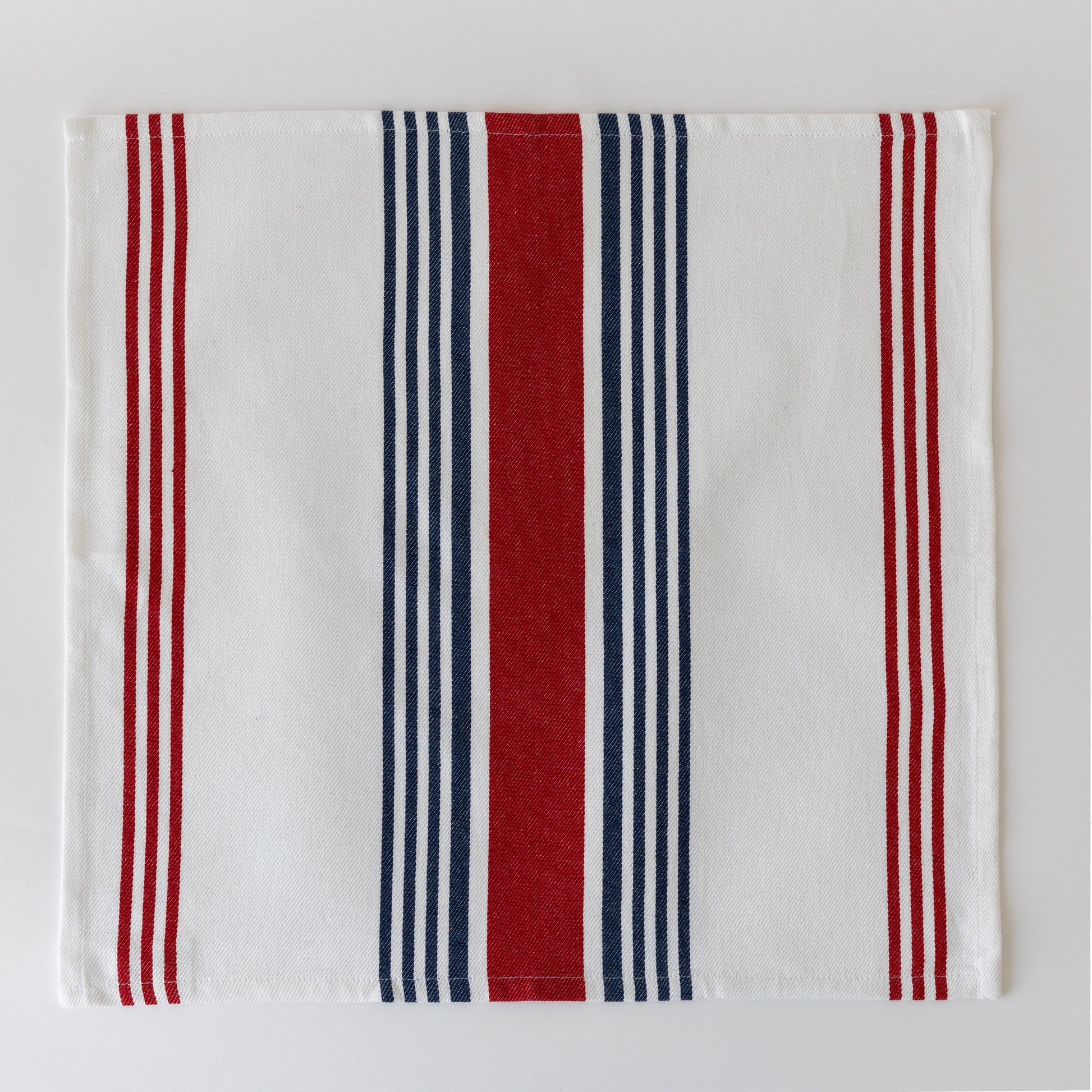 Striped cloth napkin with vertical stripes in red, navy blue, and white
