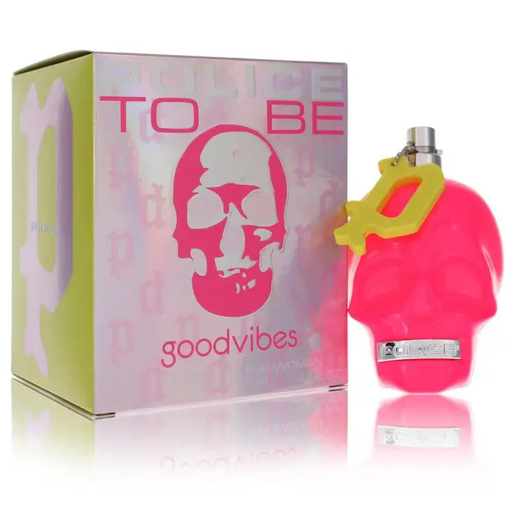 Pink perfume bottle with yellow top, shown beside matching box