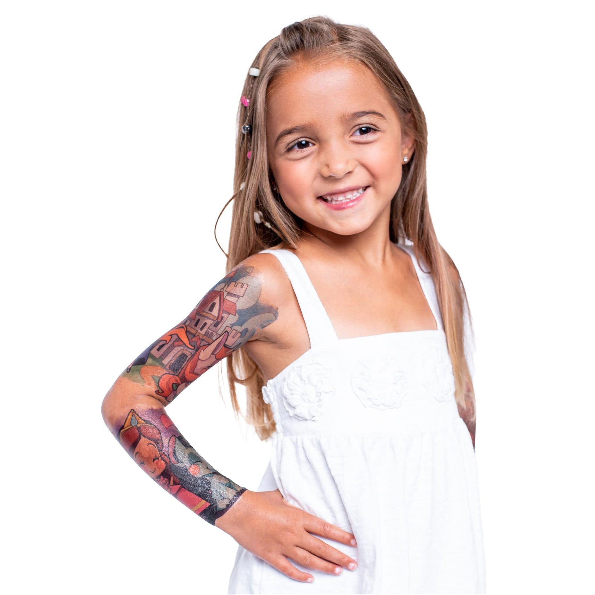 Child posing with temporary tattoo sleeve on left arm, detailed castle-style art
