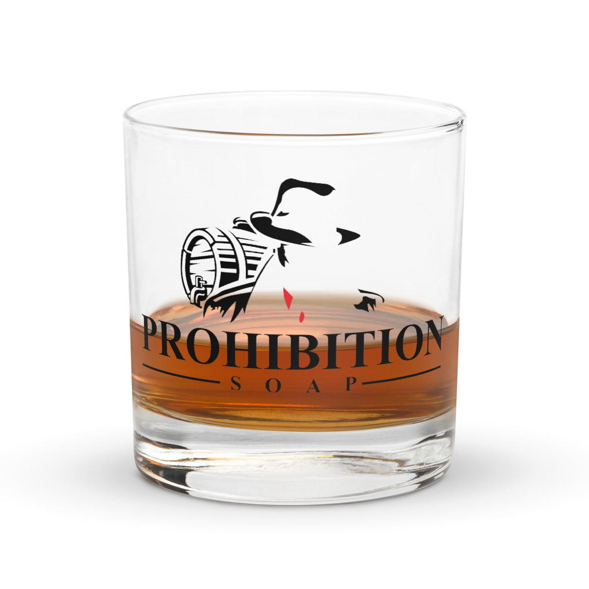 Clear glass tumbler with black logo and orange band reading PROHIBITION SOAP